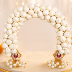 White Floral Prabhavali with Pearl & Kundan Embellishments | Varamahalakshmi Pooja Idol Decoration